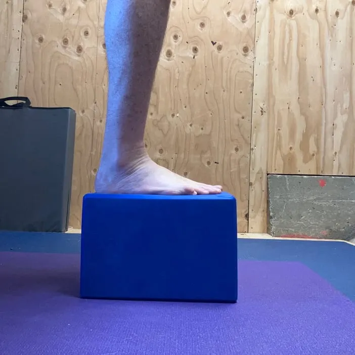 A foot standing on a superblock